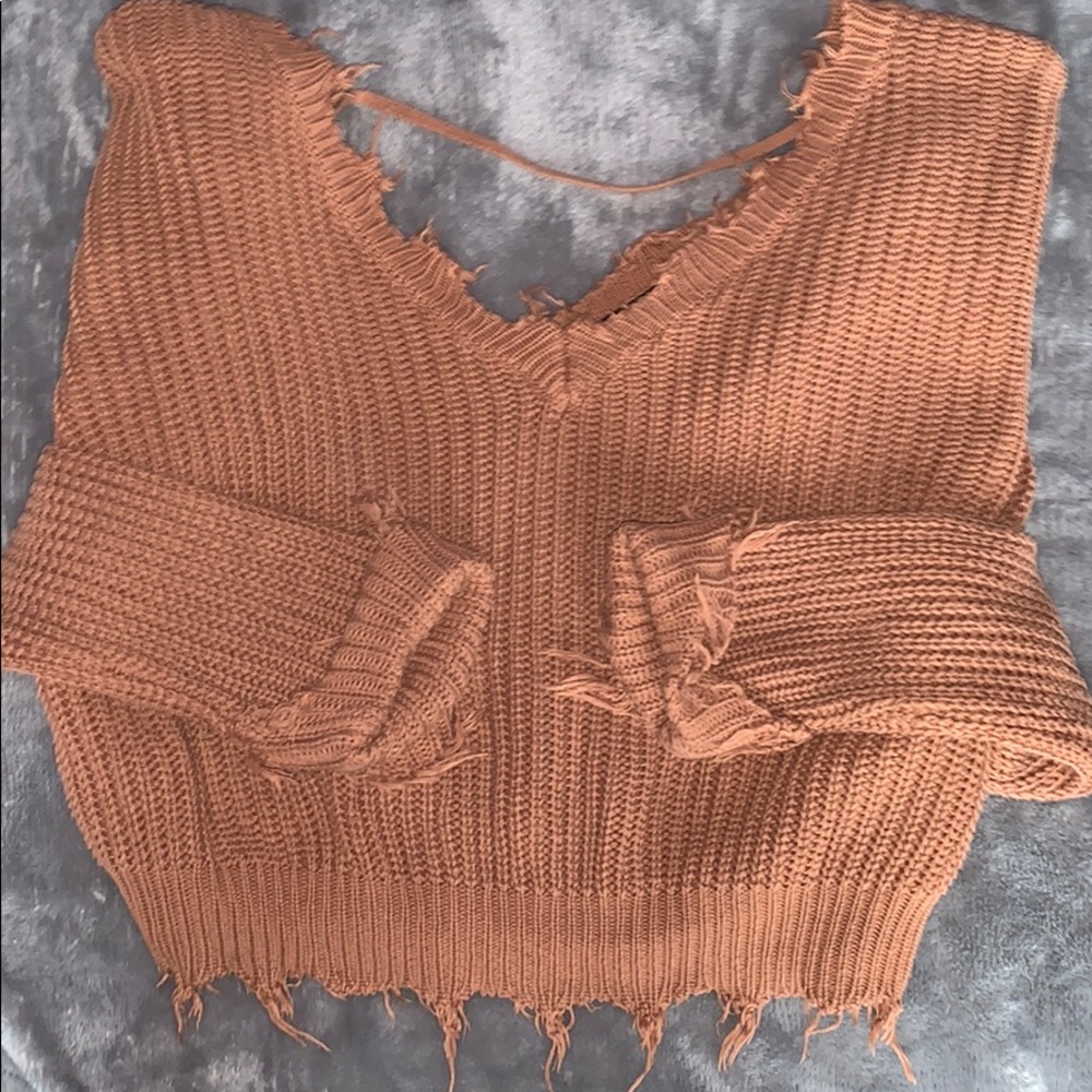 rust colored ripped up sweater size-small